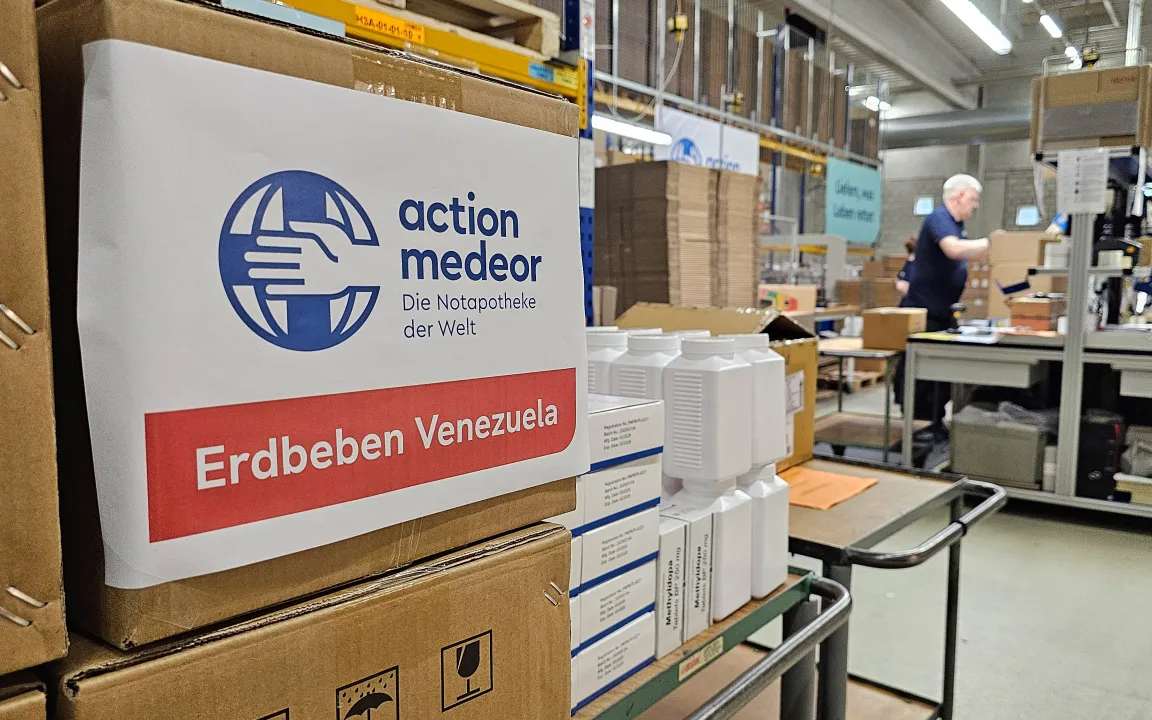 Copilot said:  A package labelled “action medeor Venezuela Earthquake Relief” in a warehouse.